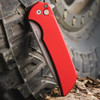 Pro-Tech Mordax red closed front view showing handle color and push button