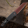 Pro-Tech Malibu BSA26.Malibu.1 shown from the spine side on a dark wood background. The black aluminum handle, copper rose PVD hardware, and tip-up pocket clip are visible in profile, showing the overall proportions of the Malibu platform from the back of the knife.