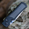Hogue Saxum 24691-LIM matte black 6061-T6 aluminum handle — smooth carbon fiber inserts, Button Lock, blue thumb studs, Collector Series
