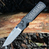 Hogue Saxum 24691-LIM open — CPM MagnaMax stone tumbled drop point blade, matte black aluminum carbon fiber handle, Button Lock