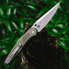 Pro-Tech Avalon Peace Neighbor PN1101-GREEN — open, blade and pivot detail, knurled aluminum handle, outdoor foliage background
