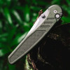 Pro-Tech Avalon Peace Neighbor PN1101-GREEN — open, angled view showing dual thumb studs and deep carry clip, outdoor setting