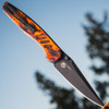 Pro-Tech Avalon Peace Neighbor "Del Fuego" PN1104-DF — closed, Del Fuego gradient anodized aluminum handle, outdoor sky background