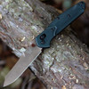 Benchmade 940 Osborne 940FE-2601 open — CPM-S90V FDE Battlewash reverse tanto, Taiga Green aluminum, steel liners, AXIS Lock