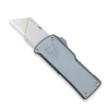 The CobraTec OTF Utility Knife (CTOTFUTGRY) shown with its dual action OTF mechanism, standard replaceable utility blade, grey anodized 6061-T6 aluminum handle, and its right-hand carry pocket clip. The spring-loaded blade lock arrow used for blade changes is visible on the carrier. ⚠️ This is an OTF automatic knife — verify legal status in your jurisdiction before purchasing.