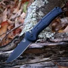 The Benchmade Claymore Auto (9070BK-02) shown with its 3.60-inch 154CM plain edge drop point blade in a Cobalt Black finish, Black Grivory handle with deeply molded texture, and its reversible deep-carry tip-up pocket clip. The push button with integrated safety lock is visible on this automatic knife. ⚠️ Verify legal status in your jurisdiction before purchasing.