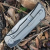 Boker Plus Collection 2026 01BP2026 — grey titanium frame, FatCarbon Marble Carbon inlays, M390 clip point blade, stonewash finish