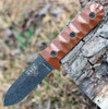 The ESEE Camp-Lore PR4 (ESEE-PR4-BO) shown with its 4.19-inch 1095 full tang plain edge spear point blade in a tumbled black finish and flat grind, brown sculptured Micarta handle, and its heavy-duty brown leather belt sheath.