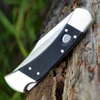 Buck 110 Auto Elite Black G-10 Nickel Silver Bolster Handle Detail View