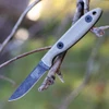 The ESEE Camp-Lore CR2.5 (ESEE-CR2.5-BO) shown with its 2.5-inch 1095 Black Oxide plain edge drop point blade in a black stonewash finish and flat grind, tan Micarta handle, and its USA-made traditional leather pouch sheath.