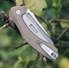 Kershaw Natrix 7007TAN open profile view showing the stonewash 8Cr13MoV blade and Tan G-10 handle scales.