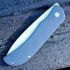 Boker Plus Exskelibur I 01BO137 profile view showing 3.5 inch D2 stonewashed drop point blade and hybrid G-10 and stainless steel frame lock handle.