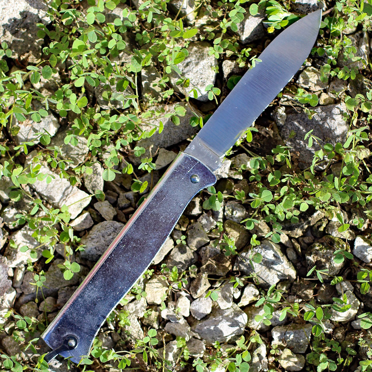 Douk-Douk Folder - Squirrel. 3 5/16" carbon steel blade. Silver finish folded steel handles with bail.