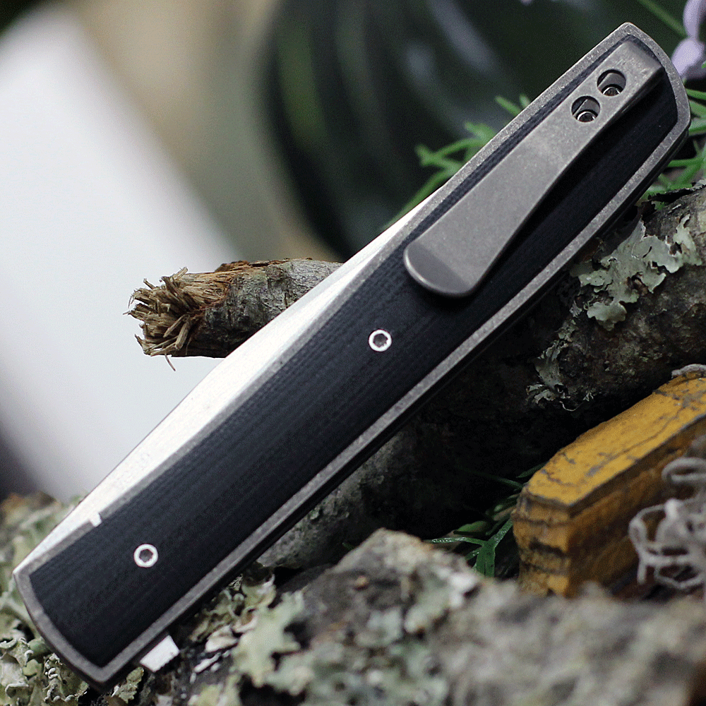 Boker Plus Urban Trapper G10 01BO732 back view highlighting the titanium framelock and slim deep-carry pocket clip.