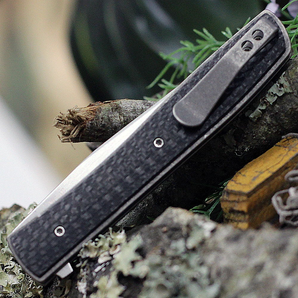 Boker Plus Urban Trapper Carbon Fiber 01BO733 back view highlighting the titanium liners and slim deep-carry pocket clip.