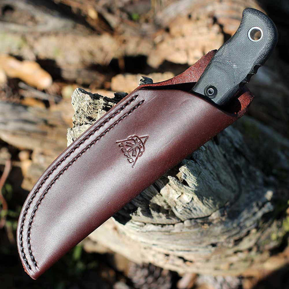 TOPS TEX4-02 Tex Creek showing the full tang and brown leather sheath.