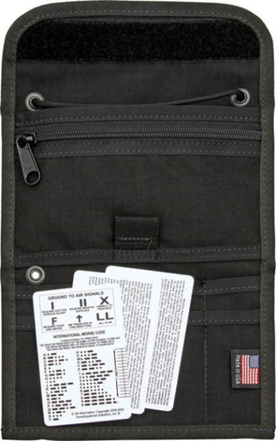 The Izula Gear Passport Case (ESEE-PASSPORT-B-X) in black nylon, shown as a tri-fold case with multiple interior pockets, a zippered pocket with hidden money flap, a Velcro closure, and grommet holes for a paracord neck strap. The Fisher Space Pen is not included.