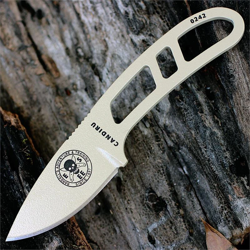 The ESEE Candiru Survival Kit (ESEE-CAN-DT-KIT) shown with its 2.00-inch 1095 plain edge drop point blade in a Desert Tan finish and flat grind, matching Desert Tan skeletonized steel handle, black polymer sheath, and the full kit: paracord, cord lock, split rings, ferro rod, whistle, and snap hook.