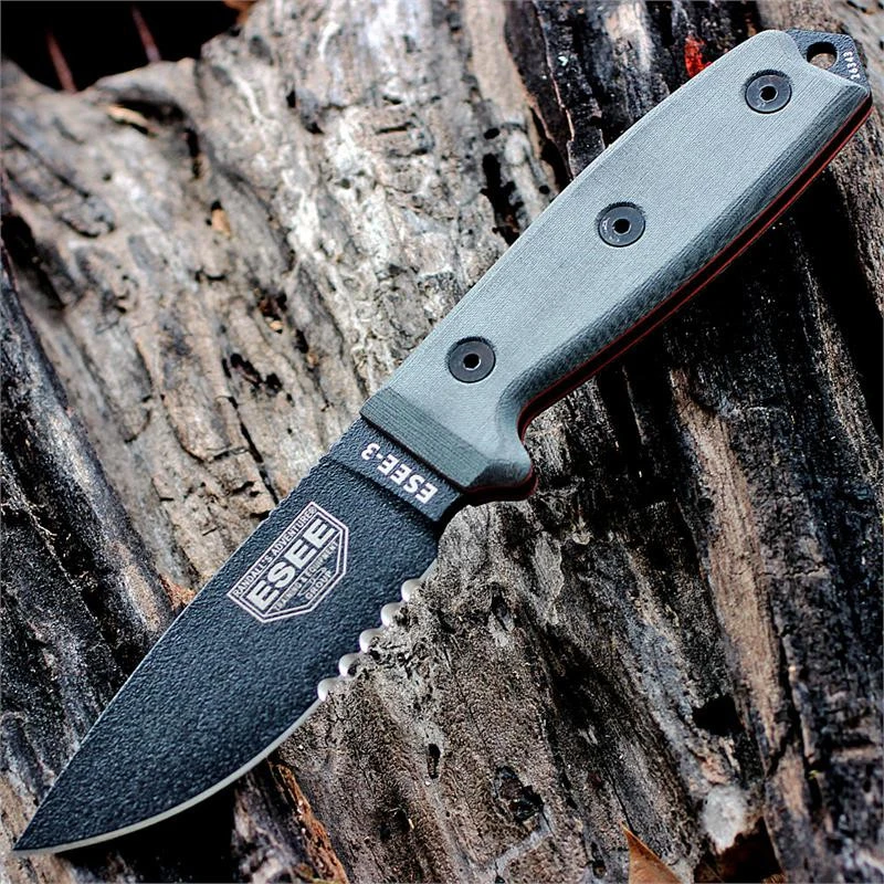 The ESEE-3 (ESEE-3S-B) shown with its 3.88-inch 1095 black part serrated drop point blade and flat grind, gray Micarta handle scales, and its injection-molded black plastic sheath.
