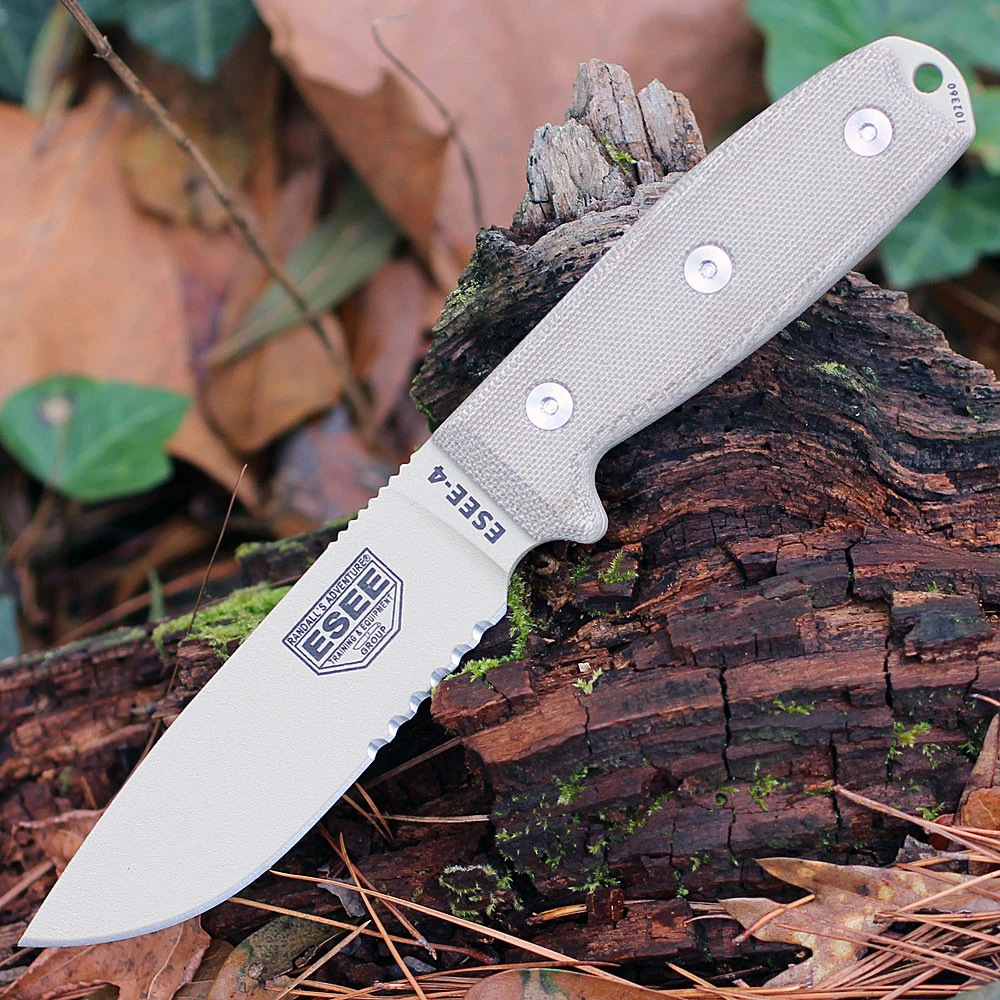 The ESEE-4 (ESEE-4S-MB-DT) shown with its 4.50-inch 1095 part serrated drop point blade in a Desert Tan finish and tall flat grind, tan Micarta handle scales, and its injection-molded OD Green polymer sheath with MOLLE back mounting.