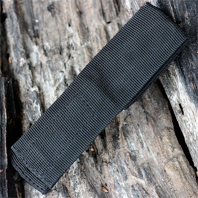 The ESEE Candiru Nylon Sheath (ESEE-CAN-SHEATH) in black nylon with a plastic liner, shown with its belt loop and hook & loop closure.