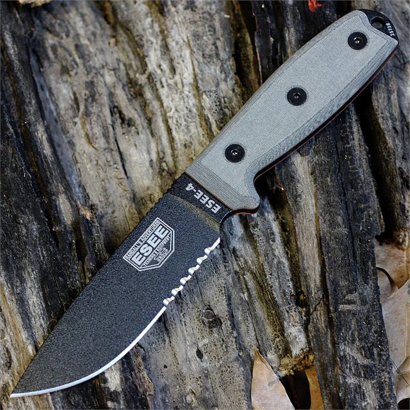 The ESEE-4 (ESEE-4S) shown with its 4.50-inch 1095 part serrated drop point blade in a black finish and tall flat grind, gray Micarta handle scales, and its injection-molded Coyote Brown polymer sheath.