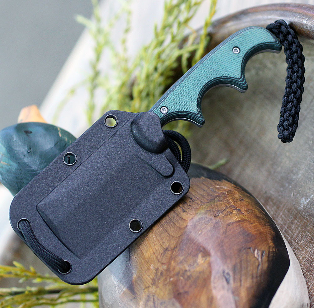 CRKT 2383 showing compact cleaver blade profile and finger-grooved grip.