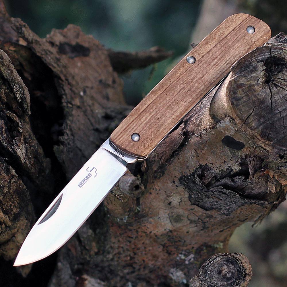 Boker Plus Tech Tool 1 01BO843 folding knife profile view showing polished Sandvik blade and zebrawood handle.