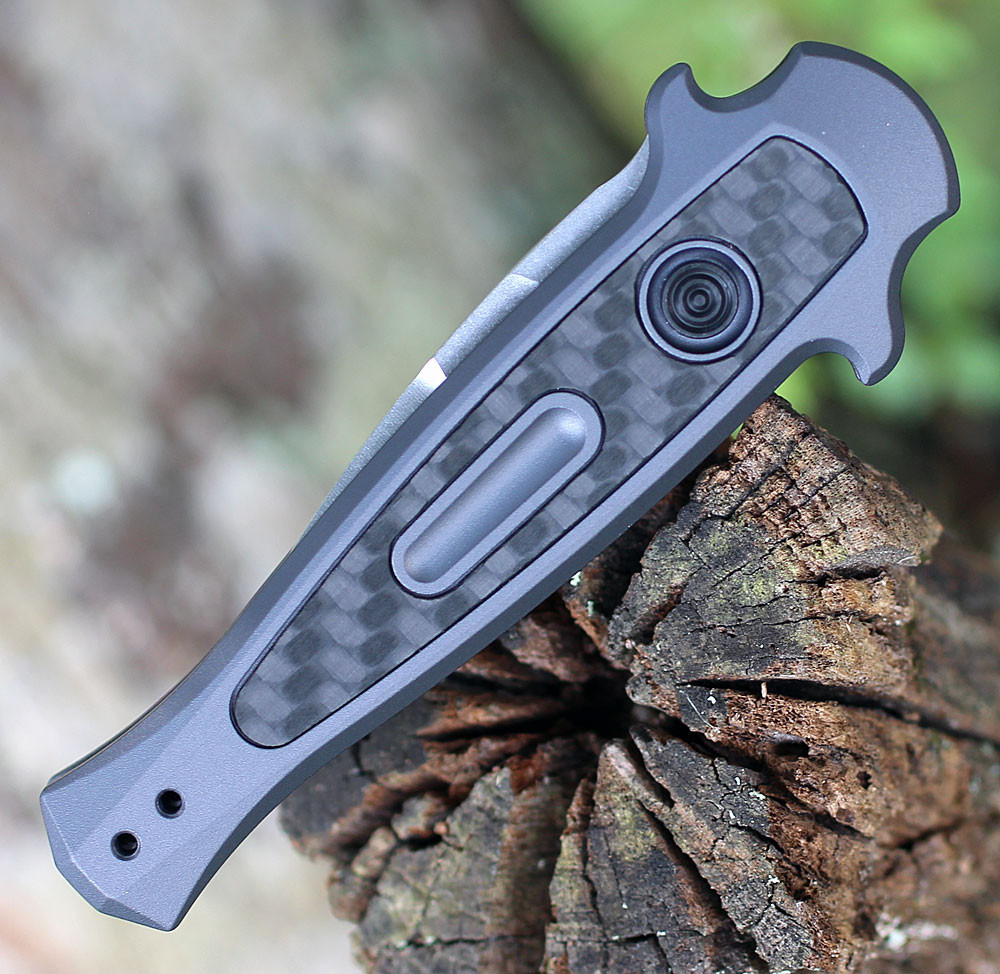 Kershaw 7130GRYSW Launch 12 CA highlighting the gray aluminum handle scales and carbon fiber inlays.