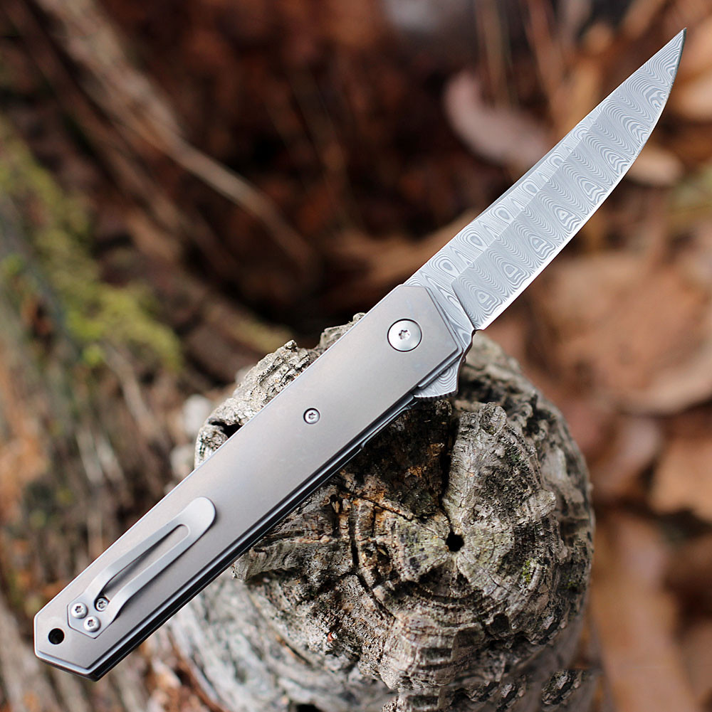 Boker Plus Kwaiken Damascus 01BO297DAM partially deployed showcasing the ball-bearing pivot and flipper tab.