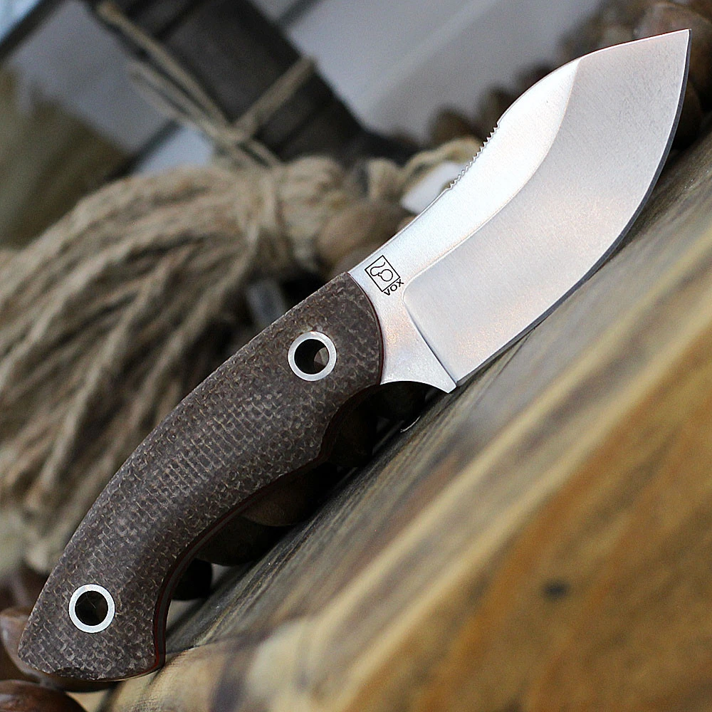 Boker Plus Nessmi Pro 02BO018 fixed blade knife profile view showing satin D2 blade and brown Micarta handle.