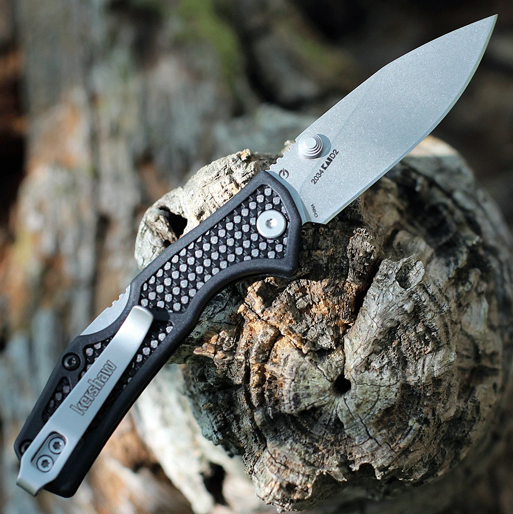 Kershaw Debris being opened via manual thumb stud showing the slim profile and deep-carry pocket clip.