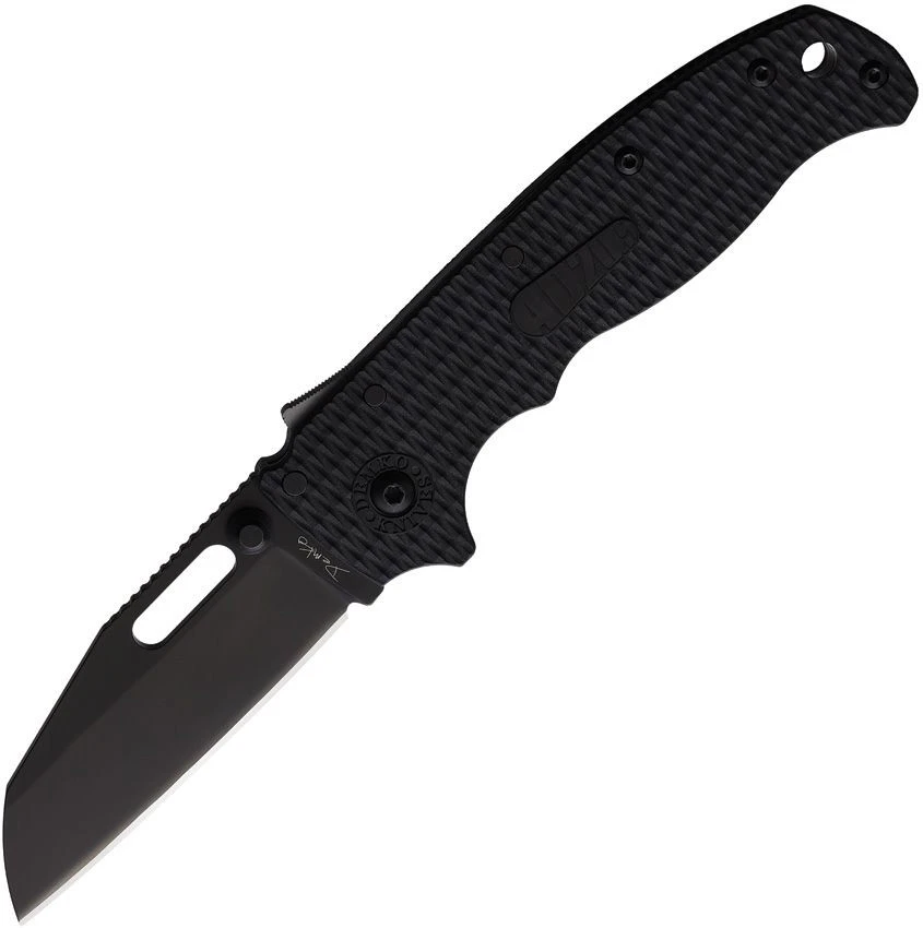 The Demko AD20.5 Shark Lock open, showing its 3.25-inch black-finished D2 Wharncliffe blade with a straight plain edge, black textured Grivory scales over steel liners, the spine-mounted Shark-Lock fin, a thumb stud and thumb hole, and a tip-up pocket clip.
