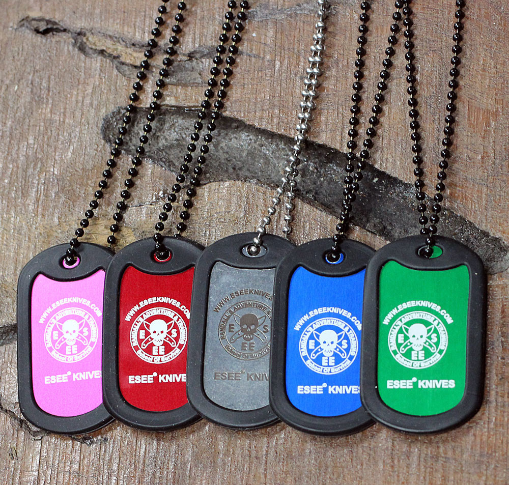 The ESEE Dog Tag (ESEE-TAGGRN), a Knifeworks Exclusive, shown in green aluminum inside a black rubber protective casing on a 24-inch ball chain.
