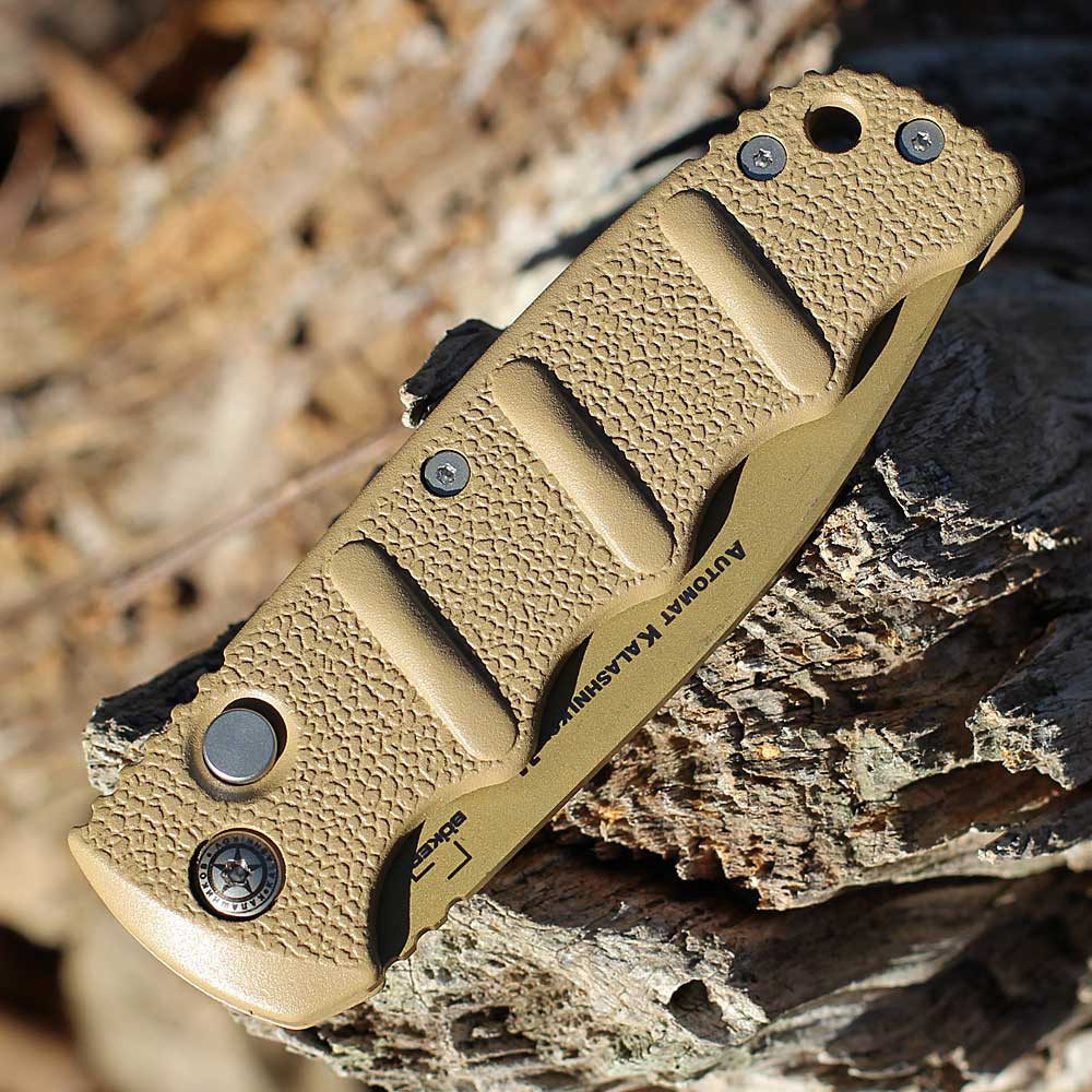 Boker Plus Kalashnikov 74 Non Auto (01KALS103N) 3.35" D2 Desert Brown Spear Point Partially Serrated Blade, Beige Aluminum Handle with Push Button Open