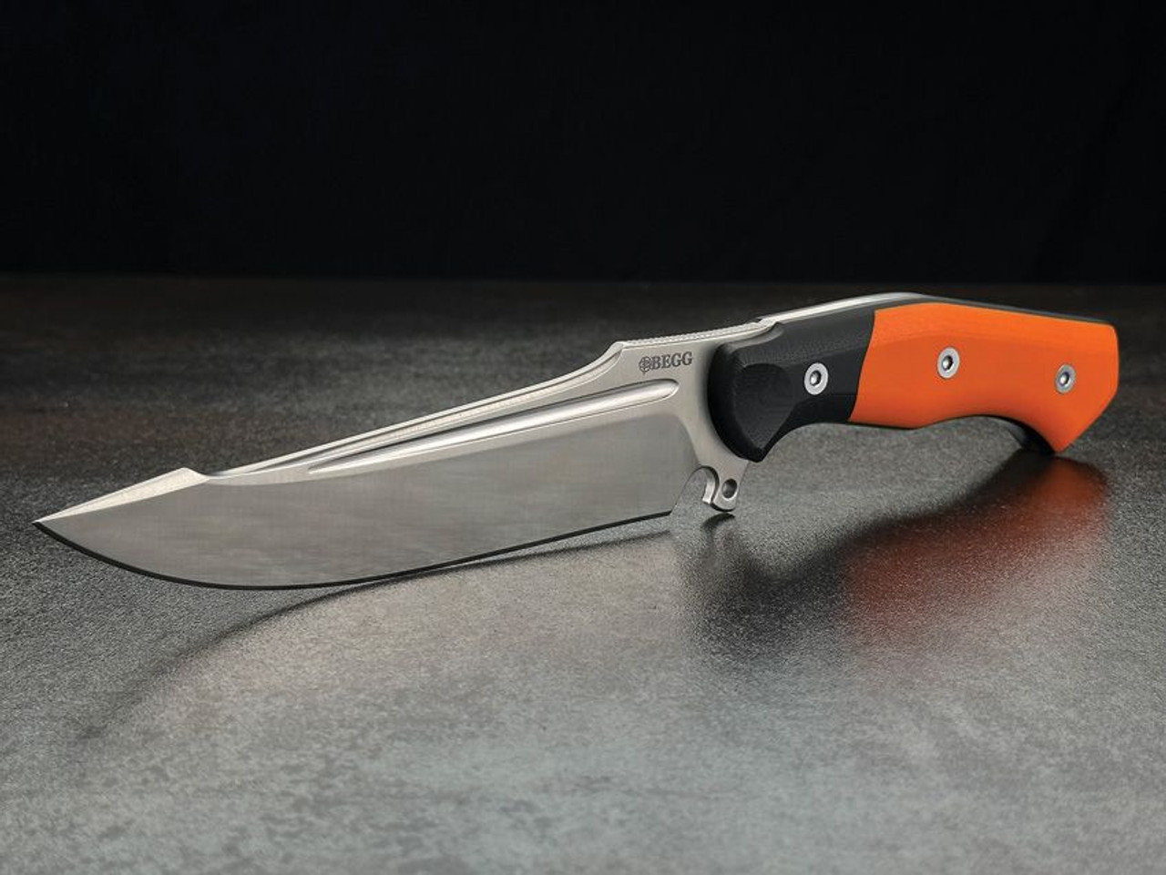 Begg Knives Alligator (BG049) 6.25" 14C28N Satin Drop Point Plain Blade, Black and Orange G-10 Handle, Black Kydex Sheath