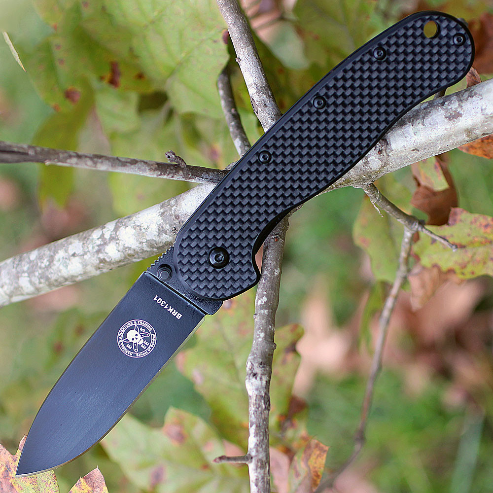 The ESEE Zancudo (BRKR2CF-B) shown with its 2.94-inch D2 drop point blade in a black finish and flat grind, black carbon fiber and G-10 handle with steel frame lock, and reversible pocket clip for tip-up or tip-down carry.