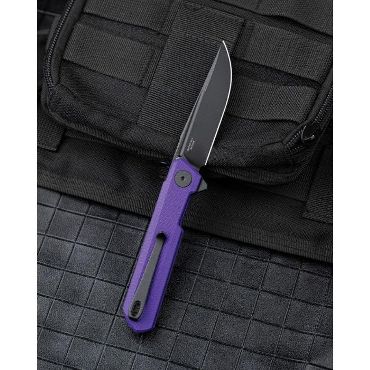 Bestechman Mini Dundee (BTKMK08D) 2.92" D2 Black PVD Coated Drop Point Plain Blade, Purple G-10 Handle