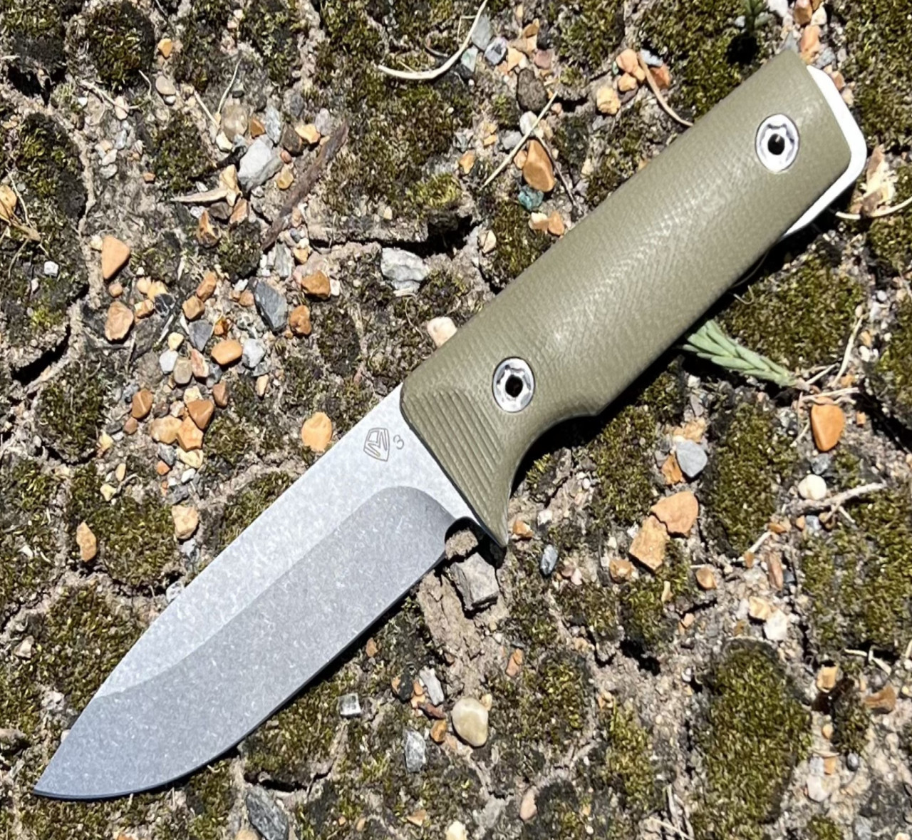 Medford Knife and Toll The San Bushcrafter (MK1203TQ-10LE-SPQ3-Q4) 4.25" 3V Tumbled Drop Point Blade, Olive Drab Green Handle, Brown Leather Sheath