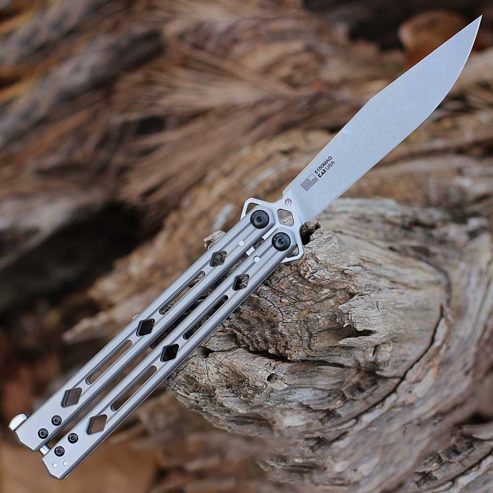 The Kershaw Lucha in mid-flip highlighting the symmetrical stainless steel handles and the 10.25-inch overall length.