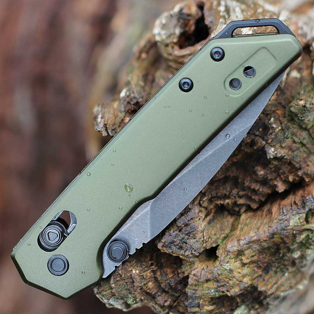 Detailed close-up of the DuraLock crossbar mechanism and thumb studs on the OD green Kershaw Mini Iridium.