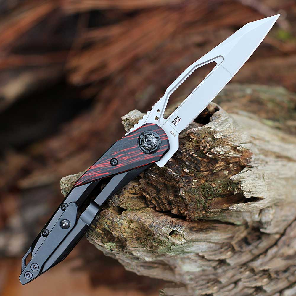CRKT Nucleus 5702 open profile view showing 3.19 inch Sandvik 12C27 bead blasted reverse tanto blade and black stainless handle with red G-10 onlay.