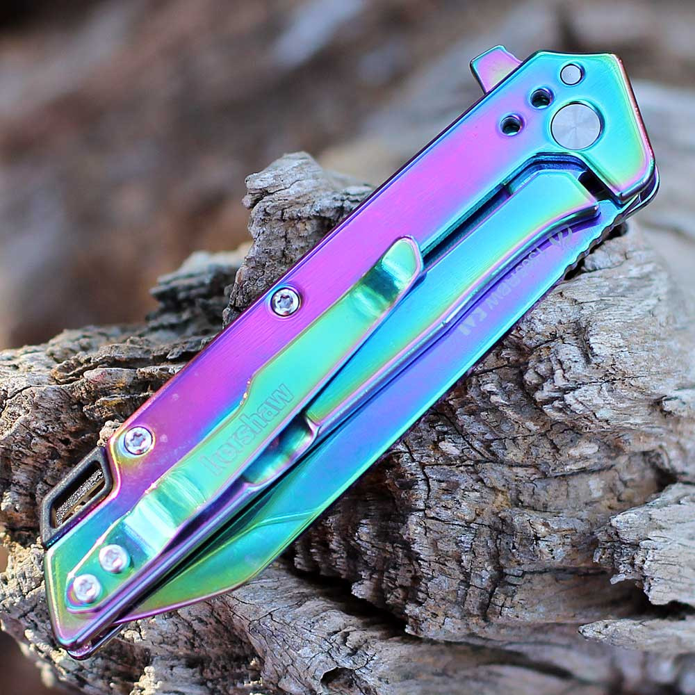 Close-up of the rainbow-finished stainless steel handle and the frame lock mechanism on the Misdirect.