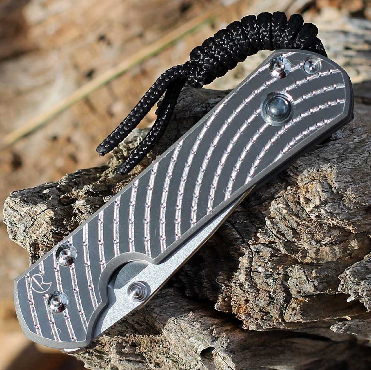 Chris Reeve Small Sebenza 31 Unique Graphic Style: SS20"A" - 2.99" Stonewash/Polished CPM-MagnaCut Drop Point Blade, Sandblasted Titanium with Hematite, Silver Hardware (S31-1408-0400)