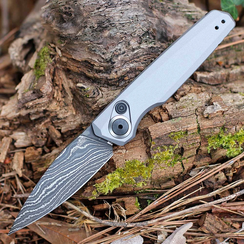 Kershaw Launch 18 7551DAM automatic knife open view showing the 2.79-inch Damascus spear point blade and gray handle.