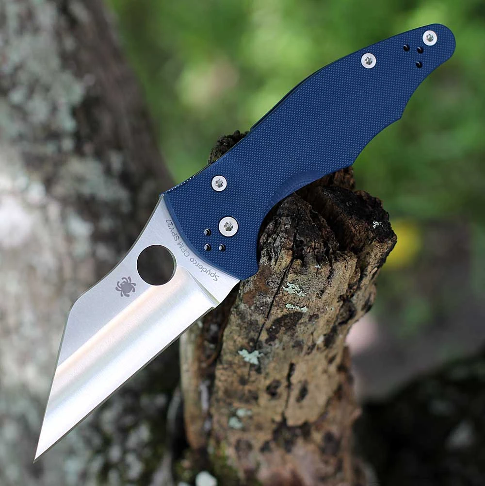 The Spyderco Yojimbo 2 C85GPCBL2 is shown open. The satin Wharncliffe blade with a straight edge and Trademark Round Hole extends from a cobalt blue textured G-10 handle.