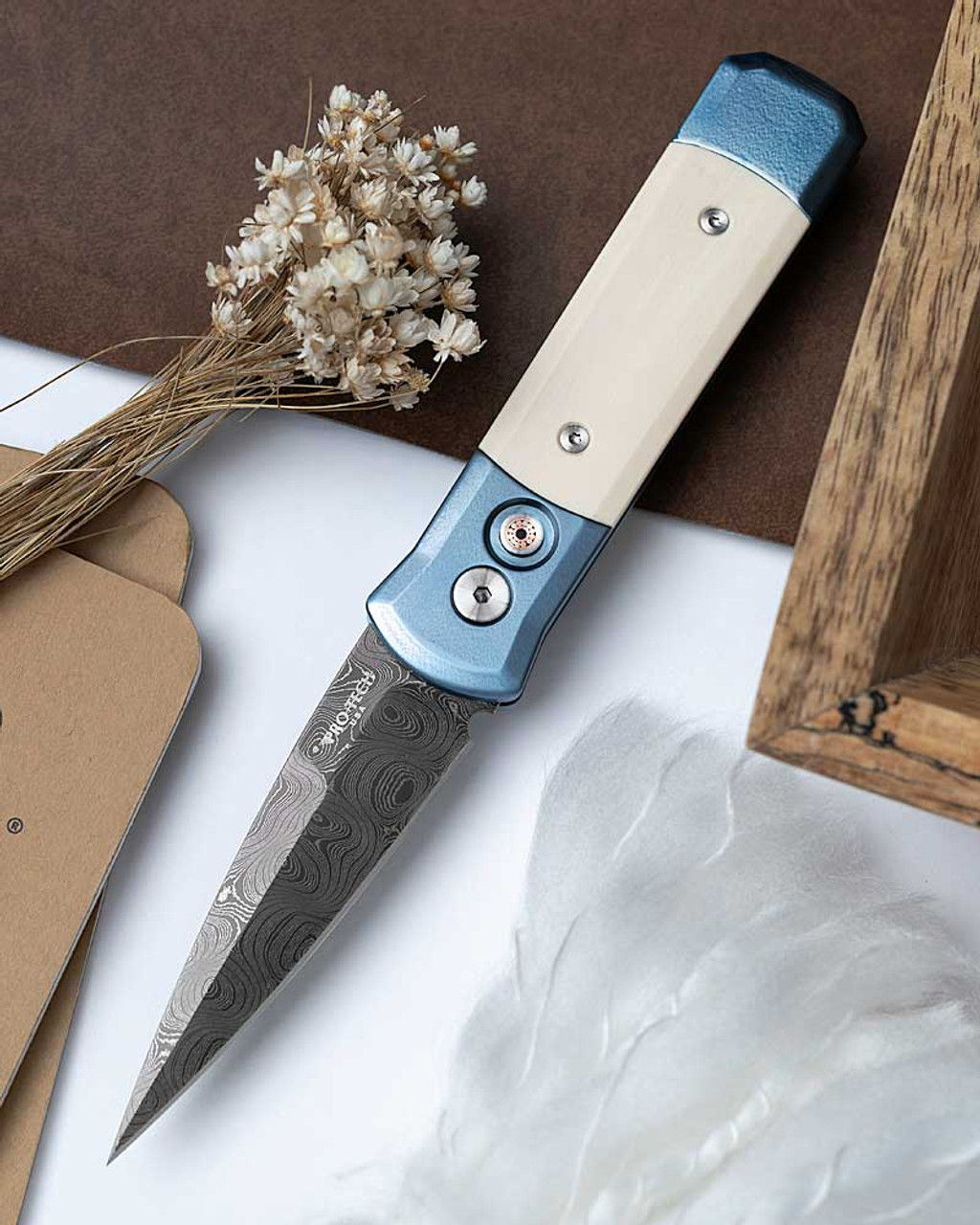 Pro-Tech 2025 Godson Custom 005 (2025GodsonCustom005) 3.15" Nichols Virus Damascus Spear Point Blade, Blue Anodized Orange Peel 6A14V Titanium Frame, Mastodon Ivory Inlays, Mosaic Pin Button, Bronze Clip