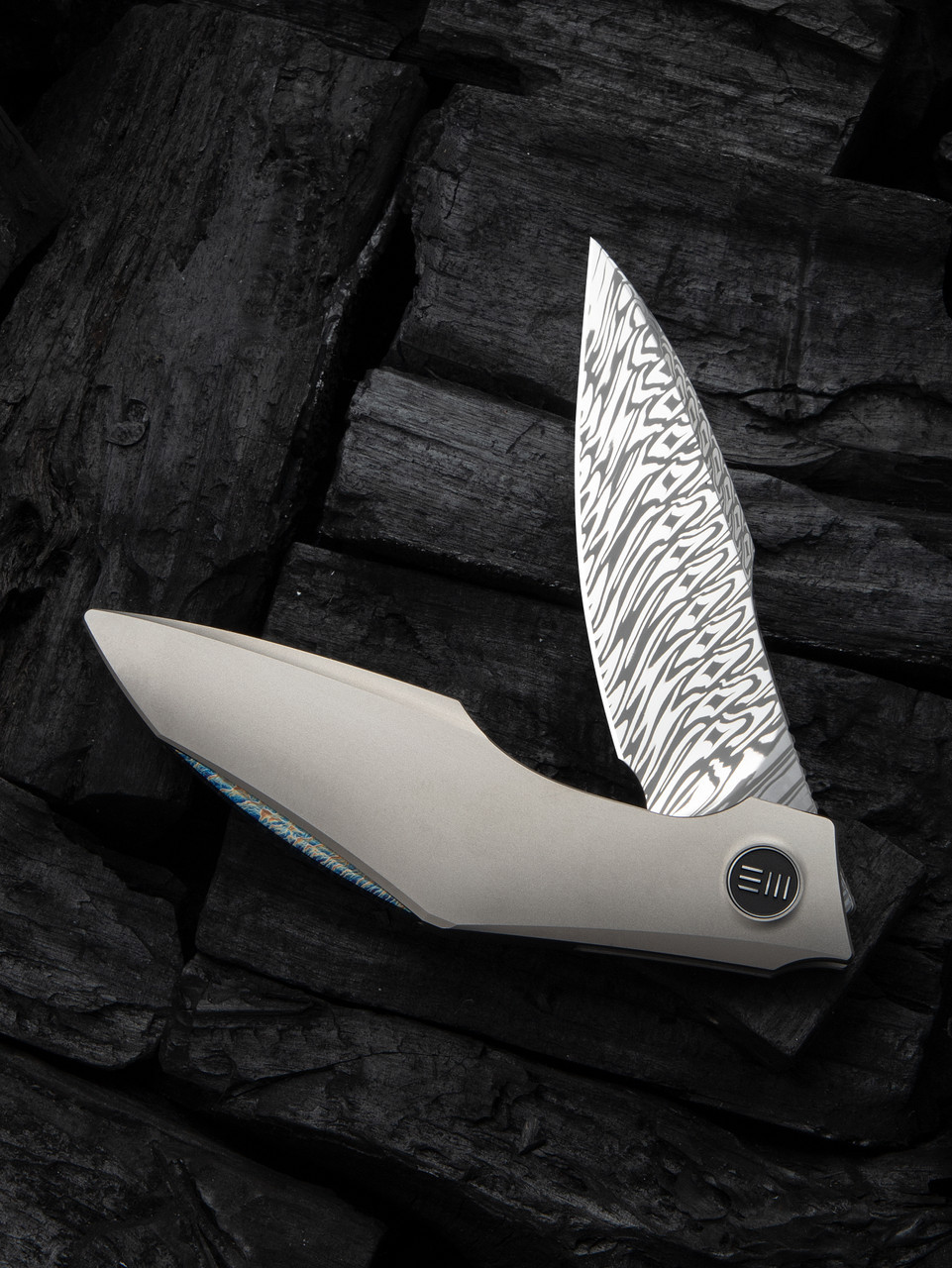 WE Knives - Krait Snake Flipper Knife (WE24084-DS1) 3.34" Fafnir Damasteel/Recurve Tip Harpoon Blade, Gray 6AL4V Titanium Handle, Gray Nested Liner Lock, "Flamed" Spacer