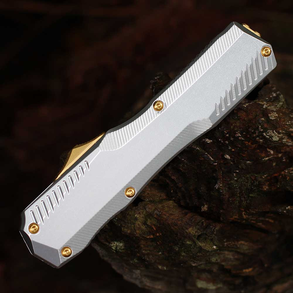 Detailed close-up of the raw 6061-T6 aluminum handle texture and the staircase-style gold thumb slide.