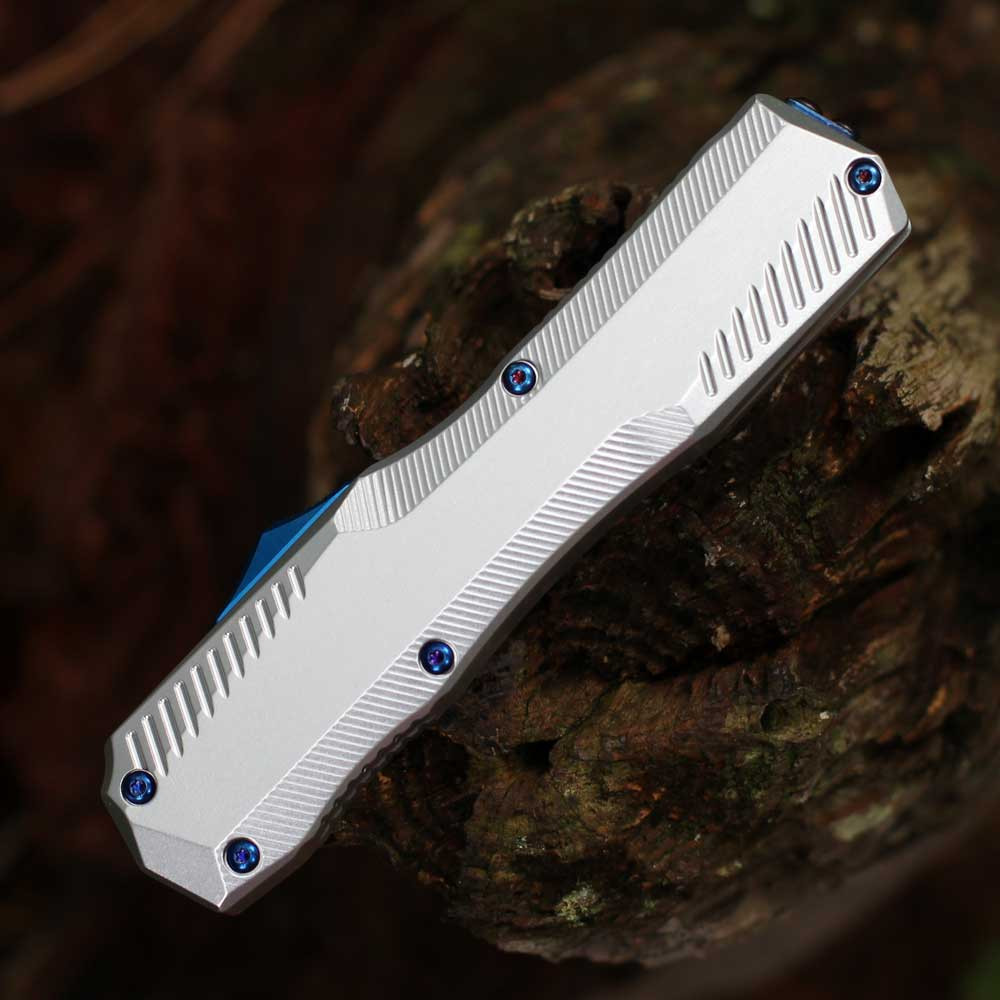 Detailed close-up of the raw 6061-T6 aluminum handle texture and the black staircase-style thumb slide.